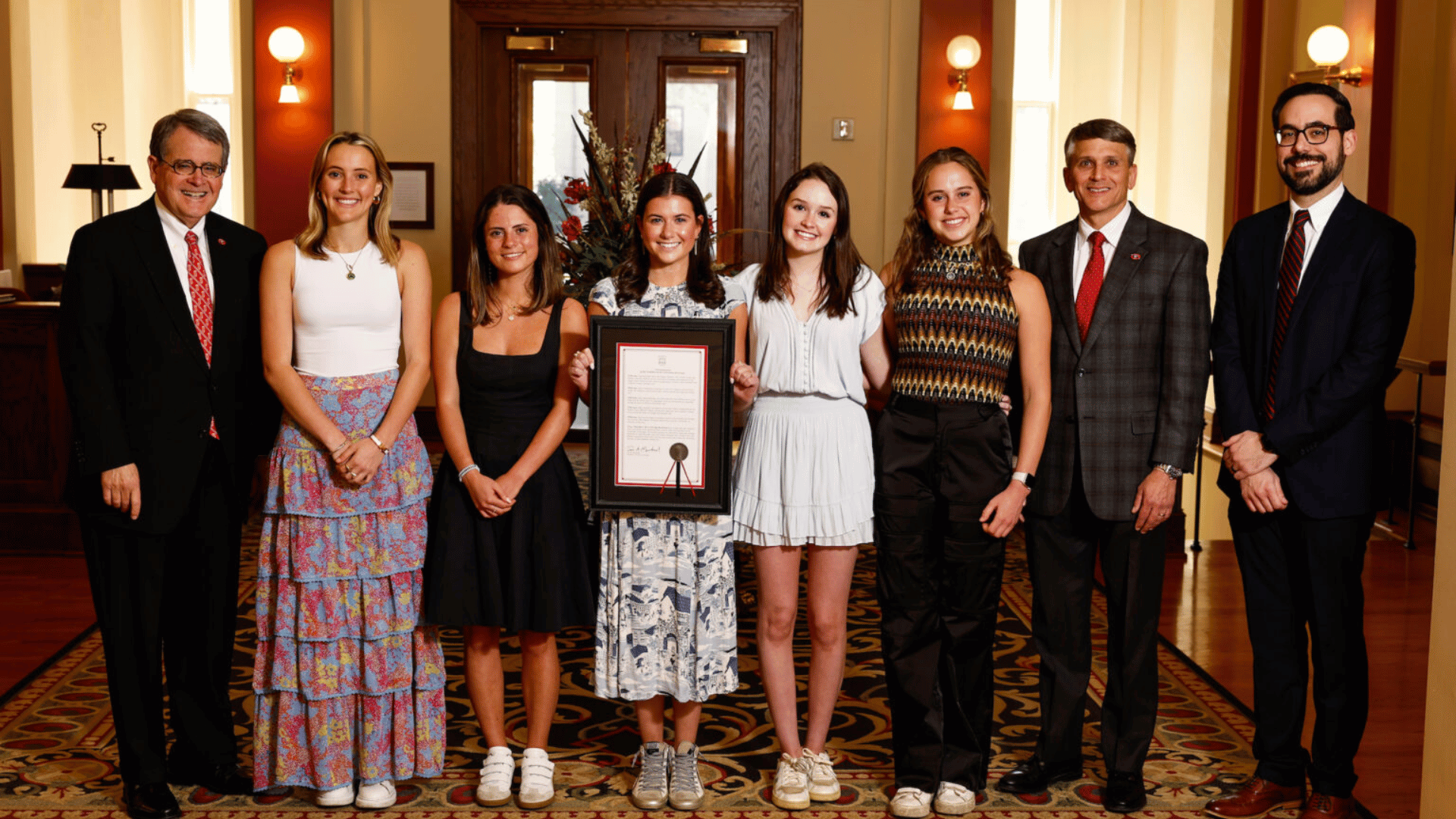 (L-R) President Jere W. Morehead presented a proclamation for the life saving heroism displayed by freshman students Eleanor Cart, Kaitlyn Iannace, Jane McArdle, Clarke Jones and Molly McCollum along with Dean of Students Eric Atkinson and Assistant to the President Rod Guajardo. (Andrew Davis Tucker/UGA)