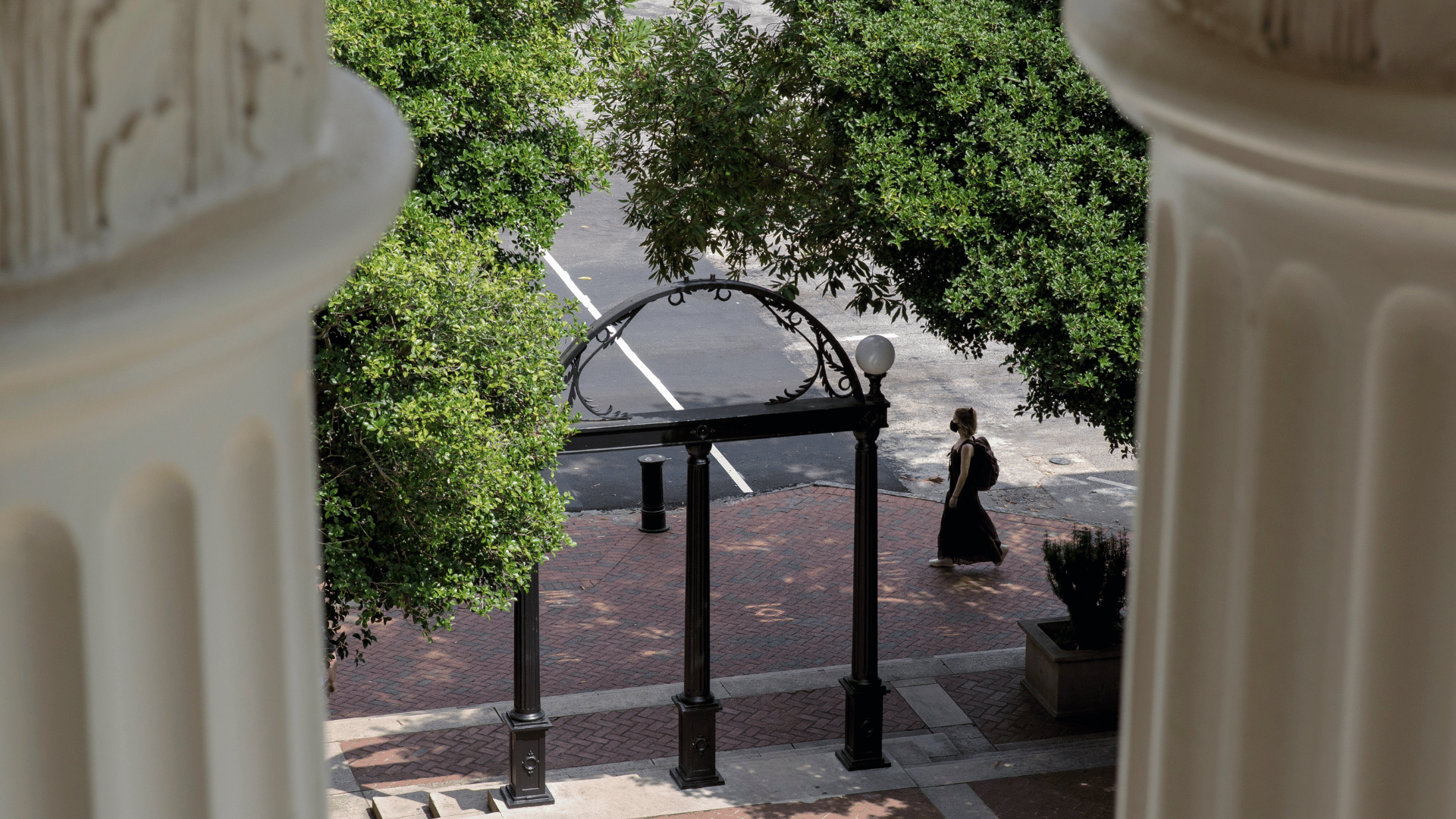 View of the Arch behind columns on UGA campus