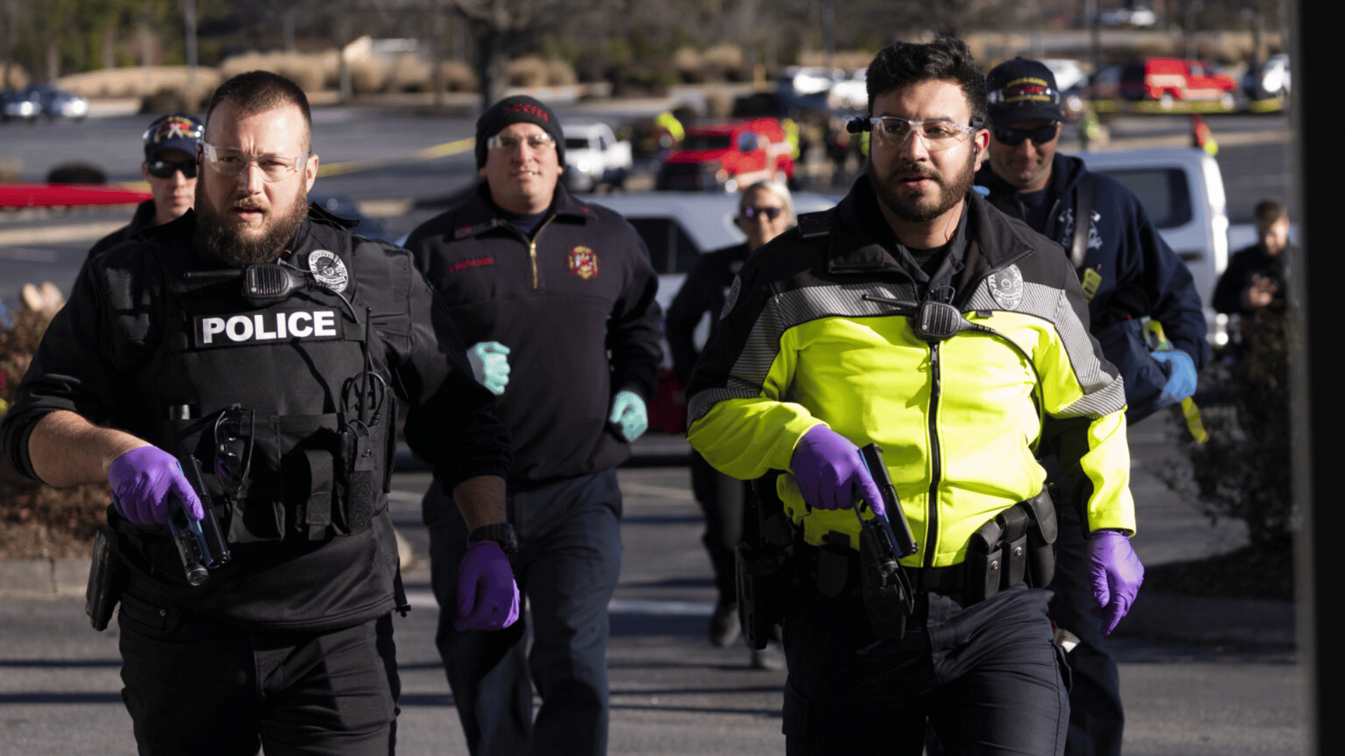 (L-R) UGA officers Detective Jason Campbell and SPO Mason Bridges lead in a team followed by firefighters and paramedics during an active threat exercise at Athens Church. (Photo by Andrew Davis Tucker/UGA)